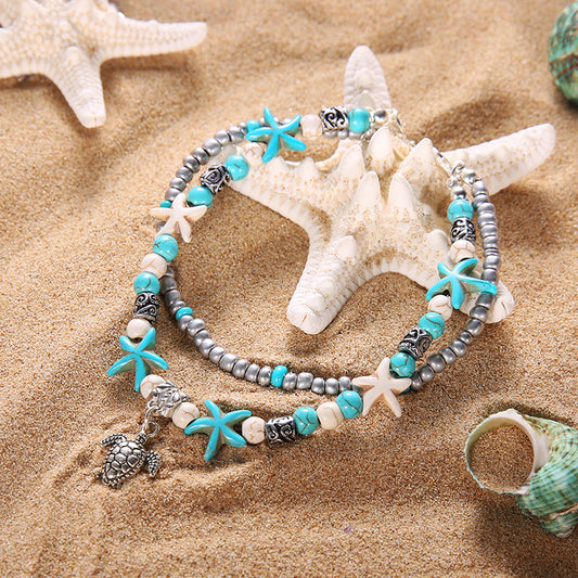 Tobillera con dije de tortuga marina turquesa y estrella de mar