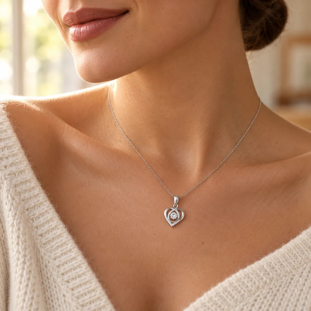 Woman wearing the open heart apology necklace