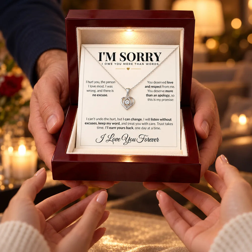 Man giving his partner an apology necklace gift box