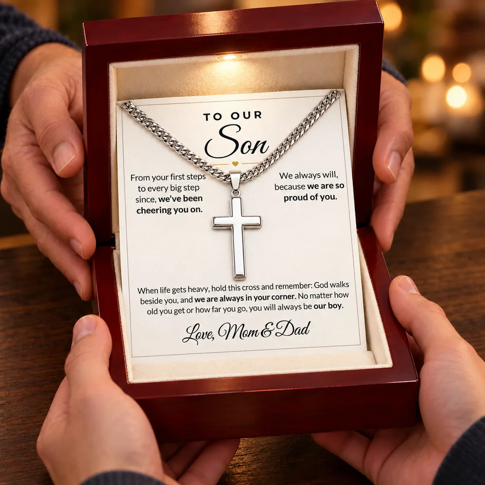 Parents giving son the cross necklace gift